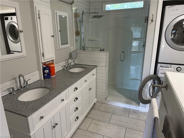 1632 Sanford Dr, Winston-Salem, NC 27105 - full bath with stacked washer and dryer, a shower stall, and a sink