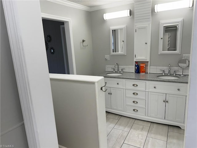 1632 Sanford Dr, Winston-Salem, NC 27105 - full bath featuring crown molding, double vanity, and a sink