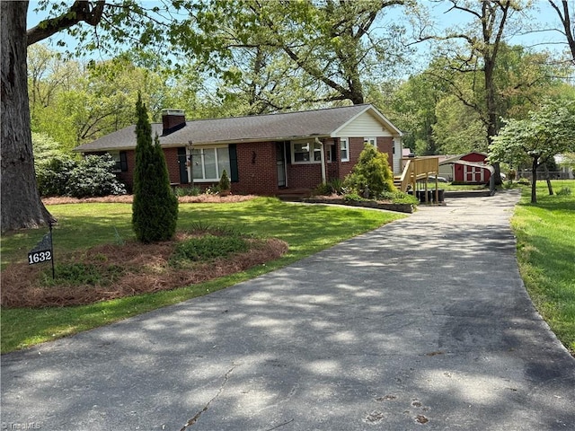 1632 Sanford Dr, Winston-Salem, NC 27105 - ranch-style home with brick siding, driveway, a chimney, and a front lawn