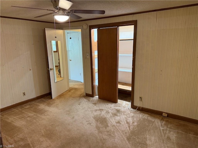 1632 Sanford Dr, Winston-Salem, NC 27105 - carpeted spare room with crown molding, ceiling fan, and a textured ceiling