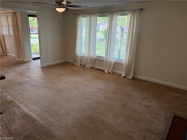 1632 Sanford Dr, Winston-Salem, NC 27105 - carpeted empty room featuring baseboards and a ceiling fan