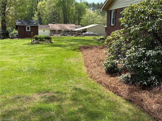 1632 Sanford Dr, Winston-Salem, NC 27105 - view of yard with a storage shed and an outdoor structure