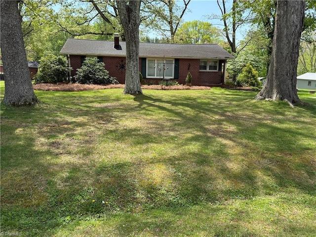 1632 Sanford Dr, Winston-Salem, NC 27105 - ranch-style house featuring a chimney, a front lawn, and brick siding