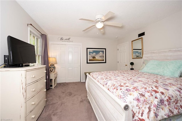 3950 Valley Ct Unit E, Winston-Salem, NC 27106 - bedroom with light colored carpet, a closet, and a ceiling fan