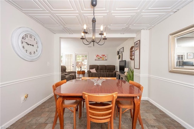 3950 Valley Ct Unit E, Winston-Salem, NC 27106 - dining space featuring a chandelier, baseboards, an ornate ceiling, and dark stone finish floors