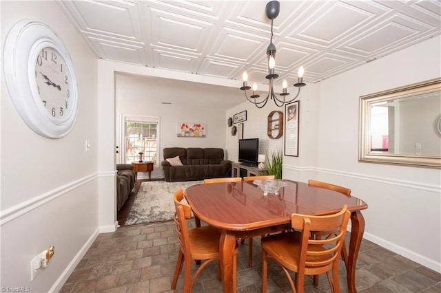 3950 Valley Ct Unit E, Winston-Salem, NC 27106 - dining area featuring a chandelier, baseboards, an ornate ceiling, and dark stone finish flooring