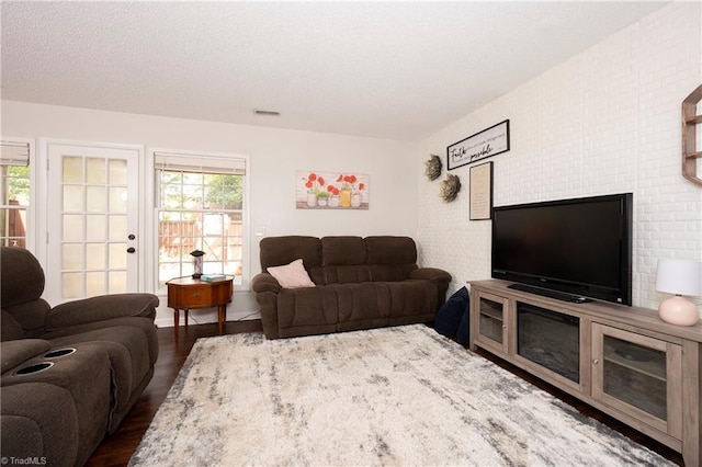 3950 Valley Ct Unit E, Winston-Salem, NC 27106 - living room featuring wood finished floors and a textured ceiling