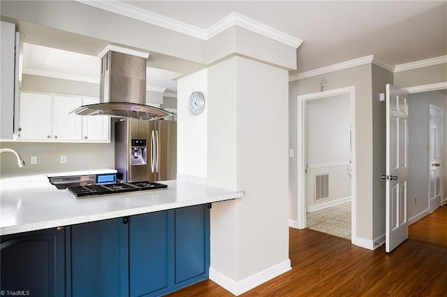 kitchen with dark wood-style floors, stainless steel appliances, visible vents, island range hood, and blue cabinets