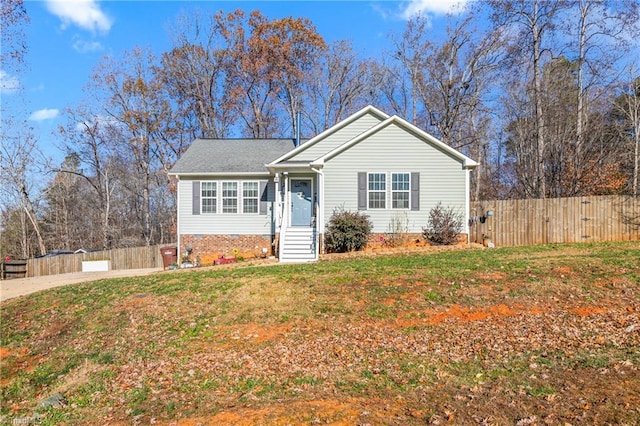 single story home with a front lawn