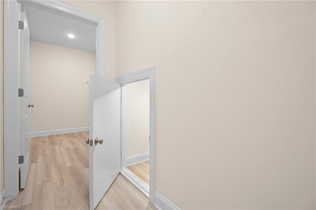 hall with light hardwood / wood-style flooring