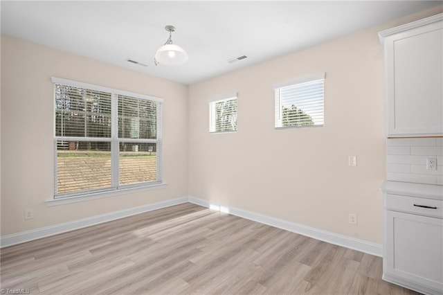 empty room featuring light hardwood / wood-style floors