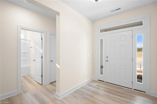 entryway with light hardwood / wood-style flooring