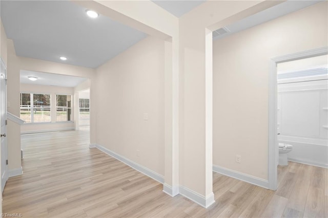 hallway with light wood-type flooring