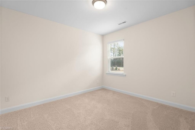 empty room with carpet flooring