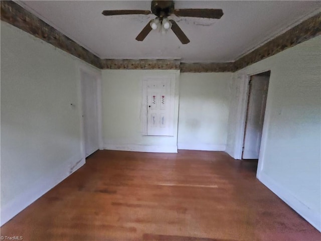 unfurnished room with ceiling fan and wood-type flooring