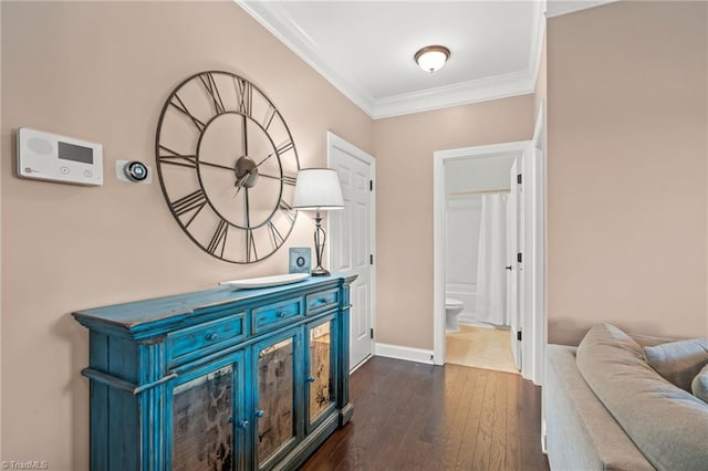 corridor with crown molding and dark hardwood / wood-style flooring