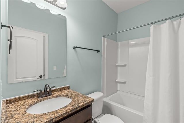 full bathroom featuring shower / tub combo with curtain, vanity, and toilet