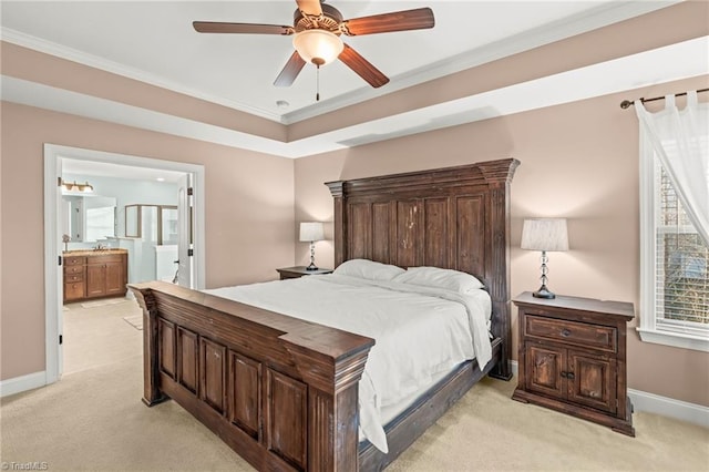 carpeted bedroom with ensuite bathroom, ceiling fan, and ornamental molding