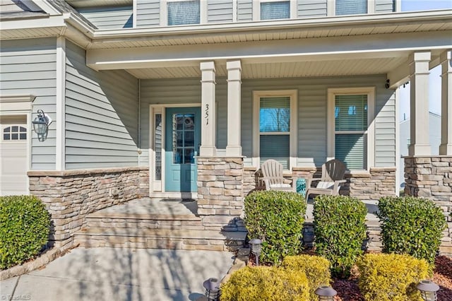 doorway to property with covered porch