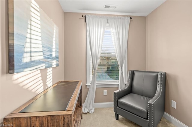 living area featuring light colored carpet