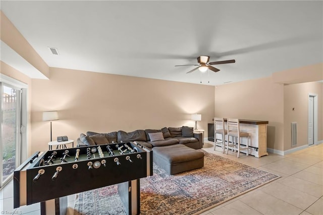 rec room with tile patterned flooring and ceiling fan