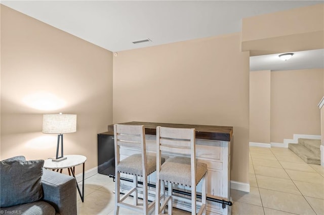 dining area featuring light tile patterned floors