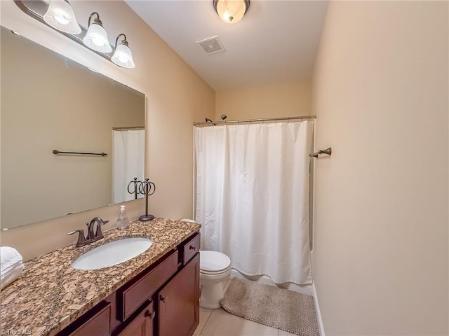 bathroom with toilet, vanity, tile patterned floors, and a shower with shower curtain