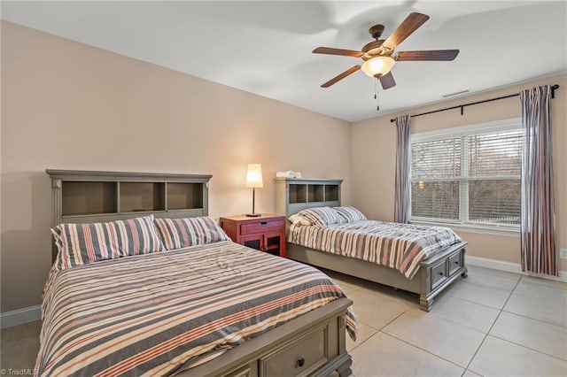 bedroom featuring ceiling fan and light tile patterned floors