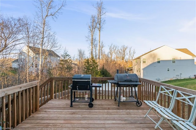 wooden terrace featuring area for grilling