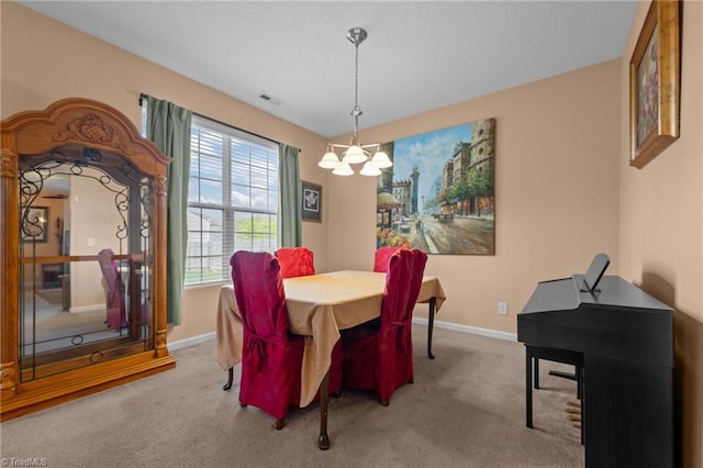 2503 Macdougall Dr, Burlington, NC 27217 - dining space featuring a chandelier, baseboards, visible vents, and carpet flooring