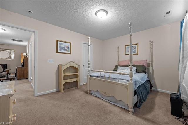 2503 Macdougall Dr, Burlington, NC 27217 - bedroom with baseboards, visible vents, light carpet, and a textured ceiling