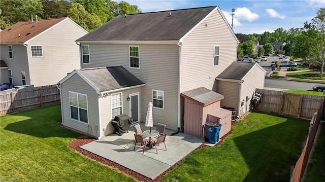 2503 Macdougall Dr, Burlington, NC 27217 - rear view of property featuring a patio, a yard, a fenced backyard, and roof with shingles