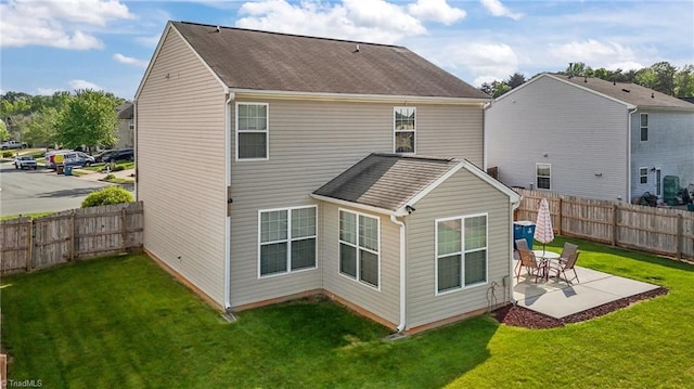2503 Macdougall Dr, Burlington, NC 27217 - back of house with roof with shingles, a patio area, a yard, and a fenced backyard