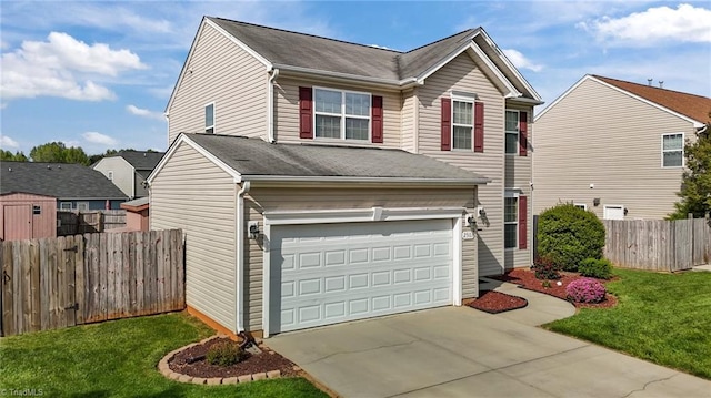 2503 Macdougall Dr, Burlington, NC 27217 - view of front of home featuring fence, a front lawn, concrete driveway, and an attached garage