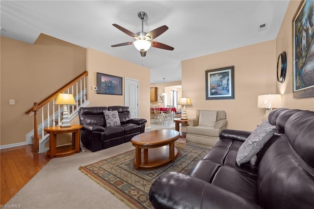 2503 Macdougall Dr, Burlington, NC 27217 - living room featuring stairs, hardwood / wood-style flooring, baseboards, visible vents, and a ceiling fan