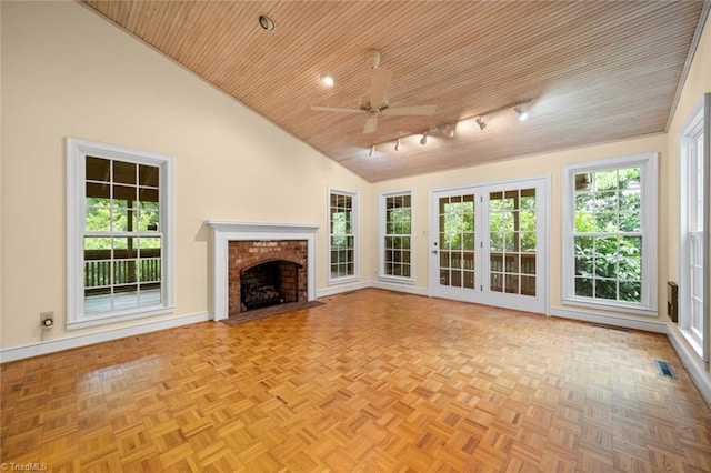 986 Avon Rd, Winston-Salem, NC 27104 - unfurnished living room with wooden ceiling, vaulted ceiling, a ceiling fan, healthy amount of natural light, and a brick fireplace
