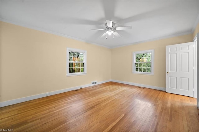 986 Avon Rd, Winston-Salem, NC 27104 - unfurnished bedroom featuring ornamental molding, light wood-style flooring, multiple windows, baseboards, and a ceiling fan