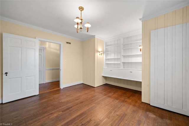 986 Avon Rd, Winston-Salem, NC 27104 - unfurnished bedroom featuring wood finished floors, ornamental molding, a chandelier, and baseboards