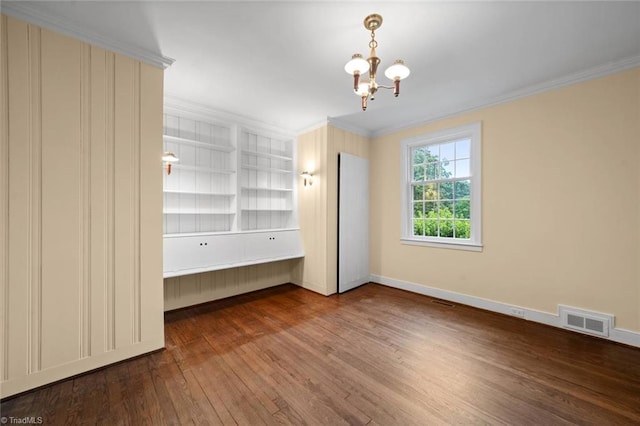986 Avon Rd, Winston-Salem, NC 27104 - unfurnished room with wood-type flooring, ornamental molding, a chandelier, baseboards, and built in shelves