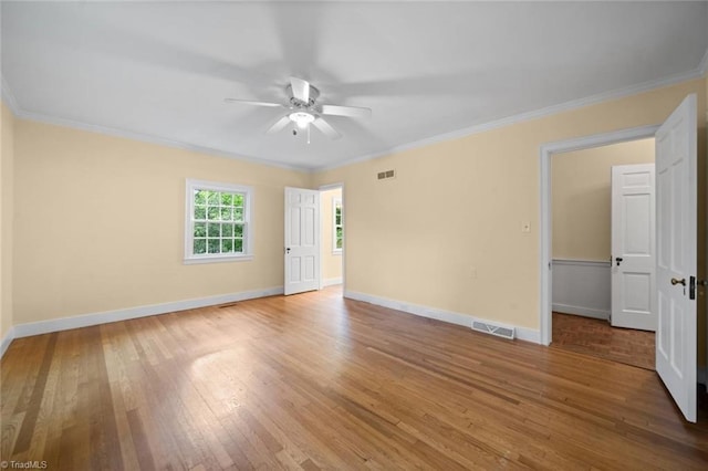 986 Avon Rd, Winston-Salem, NC 27104 - unfurnished room with wood finished floors, a ceiling fan, ornamental molding, and baseboards