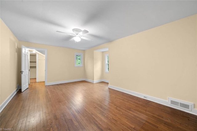 986 Avon Rd, Winston-Salem, NC 27104 - unfurnished room with dark wood finished floors, a ceiling fan, and baseboards
