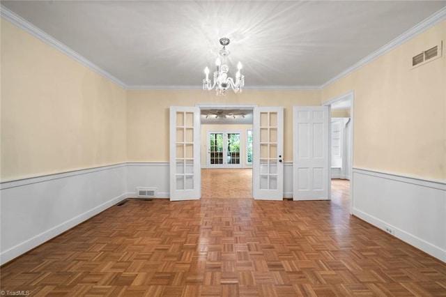 986 Avon Rd, Winston-Salem, NC 27104 - unfurnished dining area featuring french doors, a chandelier, crown molding, and baseboards