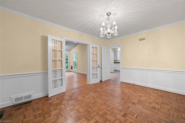 986 Avon Rd, Winston-Salem, NC 27104 - unfurnished room with french doors, a chandelier, crown molding, and baseboards
