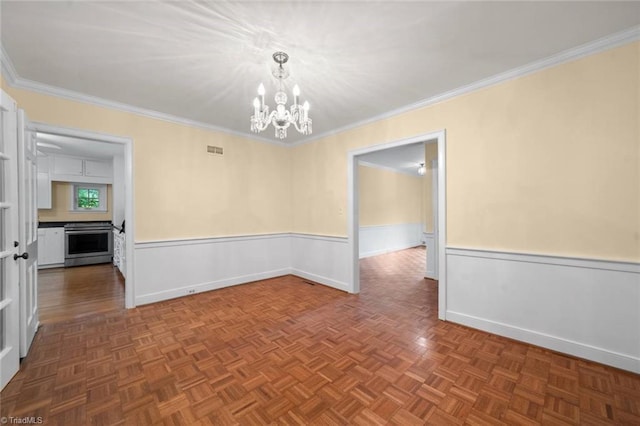 986 Avon Rd, Winston-Salem, NC 27104 - empty room with a chandelier, wainscoting, ornamental molding, and baseboards