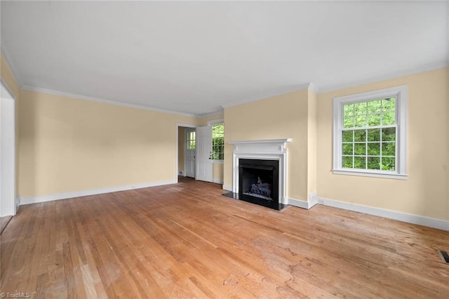 986 Avon Rd, Winston-Salem, NC 27104 - unfurnished living room with light wood finished floors, crown molding, a fireplace with flush hearth, and baseboards