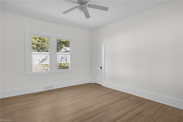4221 Old Greensboro Rd, Winston-Salem, NC 27101 - empty room featuring light wood-style flooring, baseboards, and ceiling fan