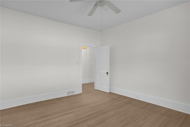 4221 Old Greensboro Rd, Winston-Salem, NC 27101 - unfurnished room featuring ceiling fan, light wood finished floors, and baseboards