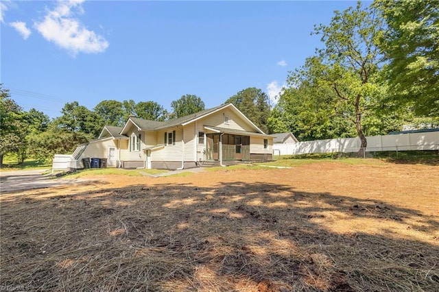 4221 Old Greensboro Rd, Winston-Salem, NC 27101 - rear view of property with fence and view of scattered trees