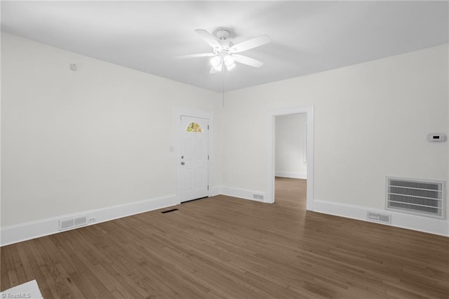 4221 Old Greensboro Rd, Winston-Salem, NC 27101 - spare room with wood finished floors, ceiling fan, and baseboards