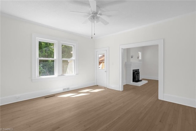 4221 Old Greensboro Rd, Winston-Salem, NC 27101 - empty room with wood finished floors, baseboards, ceiling fan, and crown molding